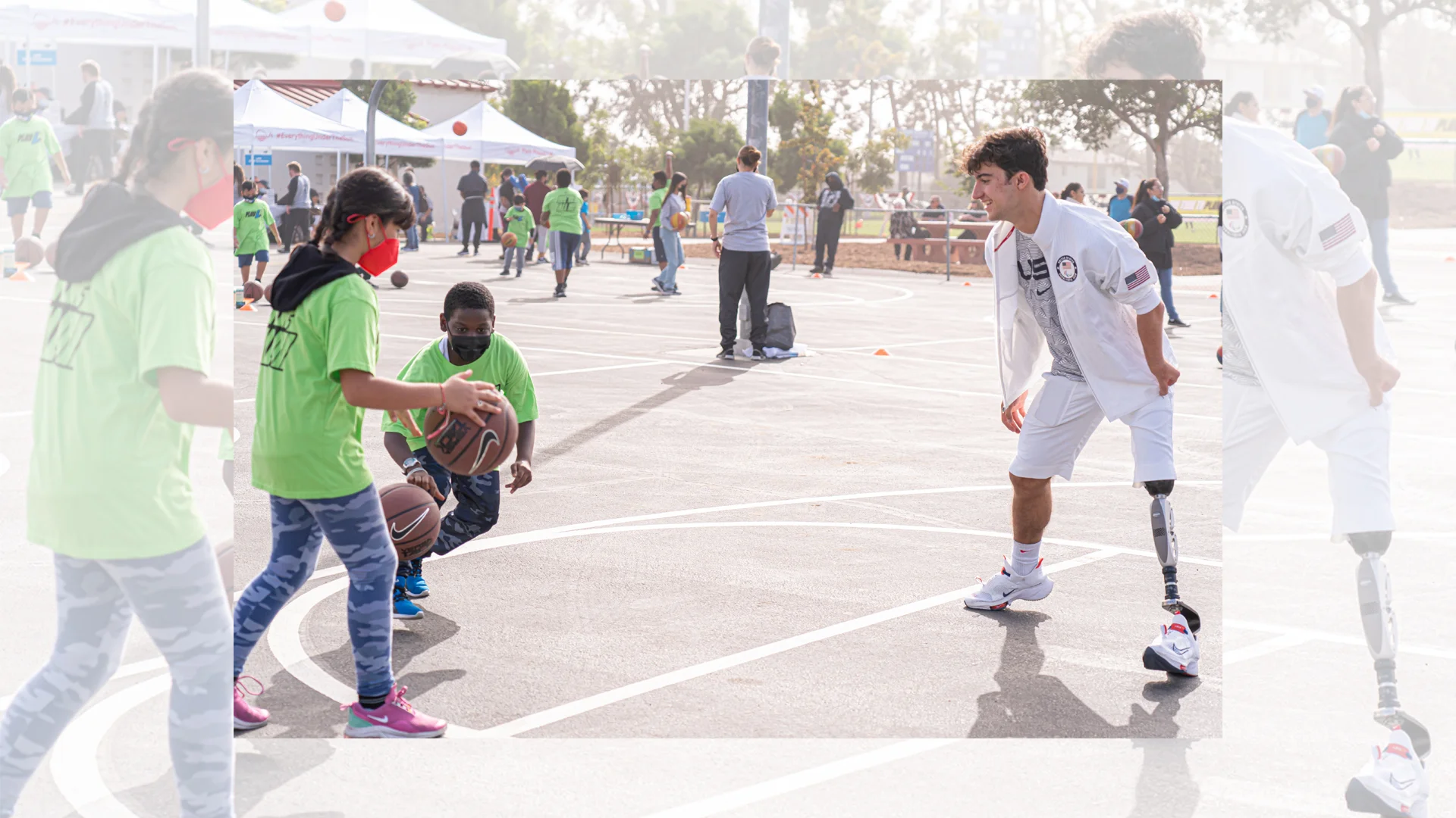 Image of Track and Field Paralympian Ezra Frech facing off with two kids wearing green PlayLA shirts in a game of Basketball