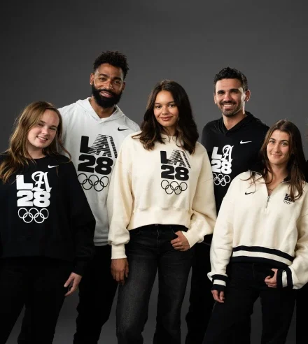 LA28 Athlete Fellows wearing various LA28 x Nike gear including t-shirts and hoodies in the colors cream, black and white