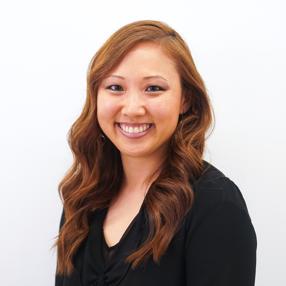 LA28 staff member Sarah Schildknecht smiling while wearing a black shirt