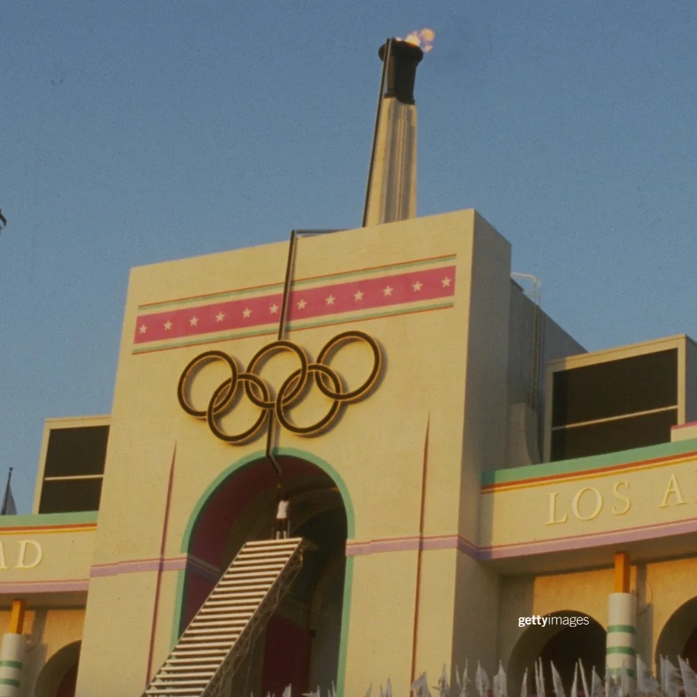 Photo of Rafer Johnson lighting the Olympic flame at the LA Memorial Coliseum at the 1984 Games
