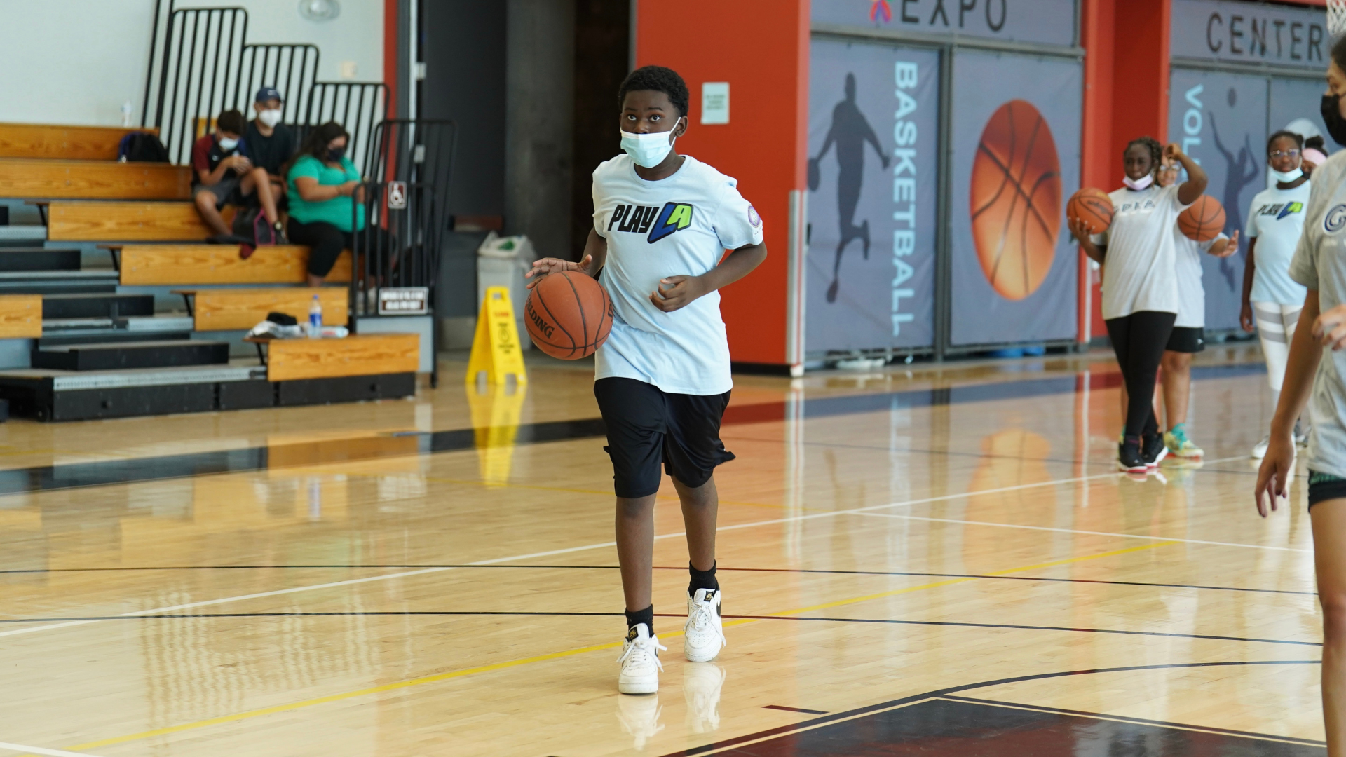 Youth playing basketball at PlayLA 