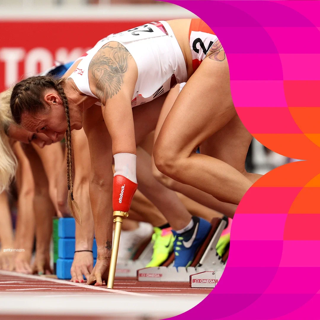 Paralympians at the starting line of a track race during the Tokyo 2020 Paralympics.