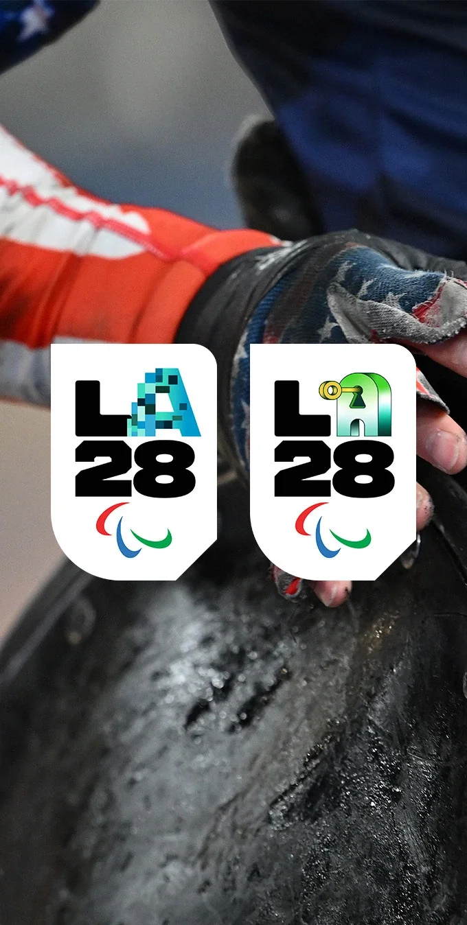 Photograph of a paralympian in a wheelchair in the background with the LA28 'Innovation Moonshot' A emblem badge and the LA28 'Relentless Innovation' A emblem badge overlayed on top