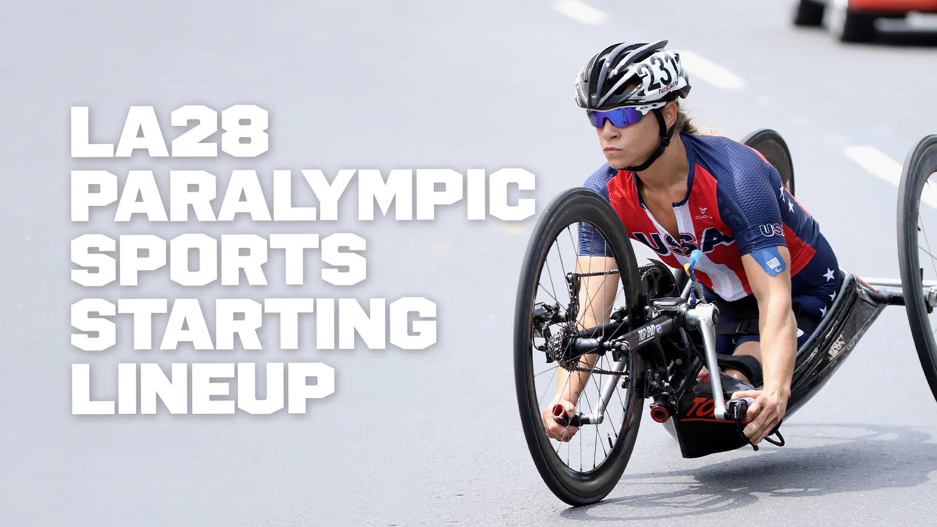 Graphic featuring a photograph of a female athlete driving a hand cycle while wearing sunglasses and a helmet and a shirt that says USA